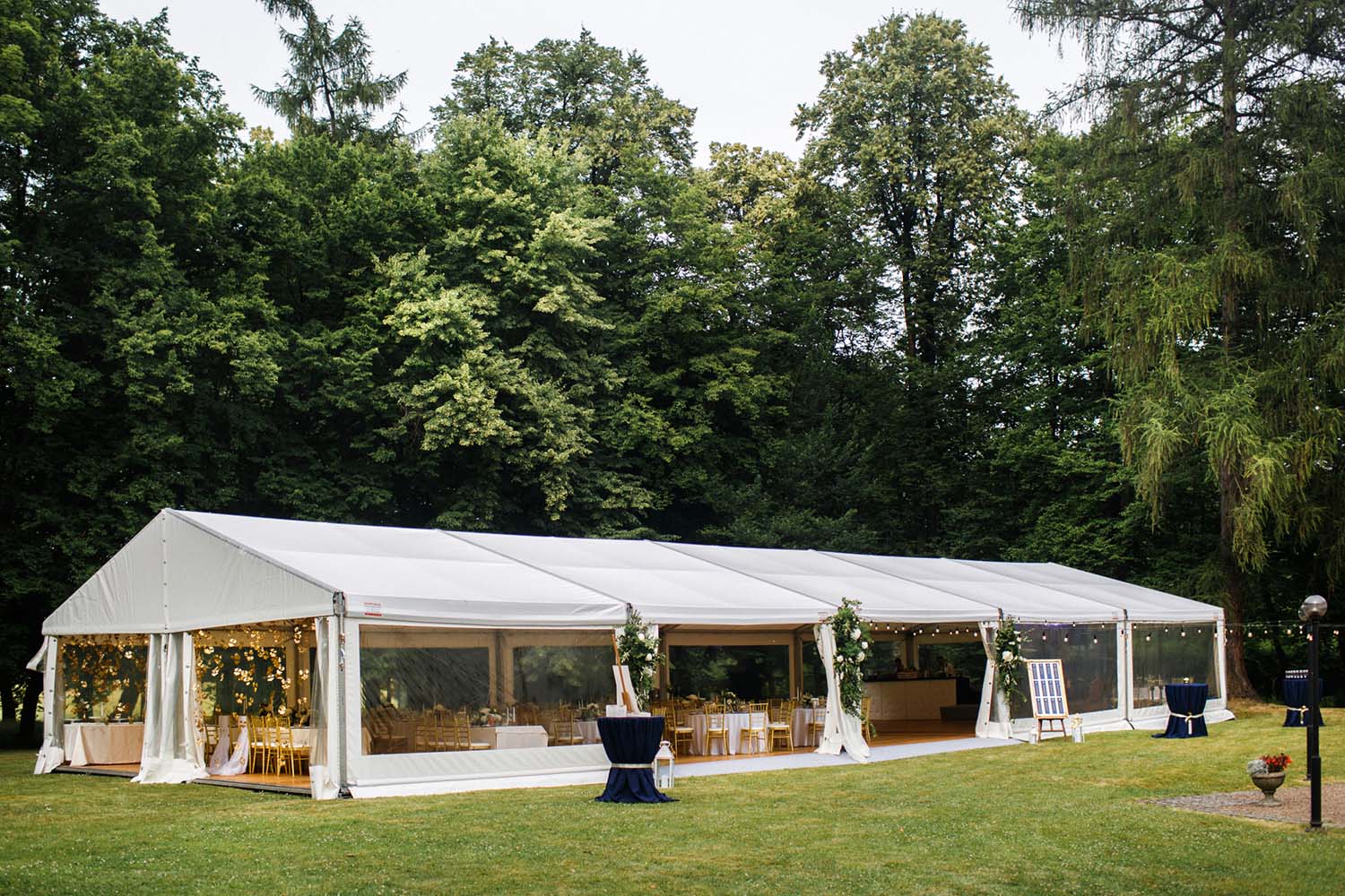 long, white marquee tent in woods L size